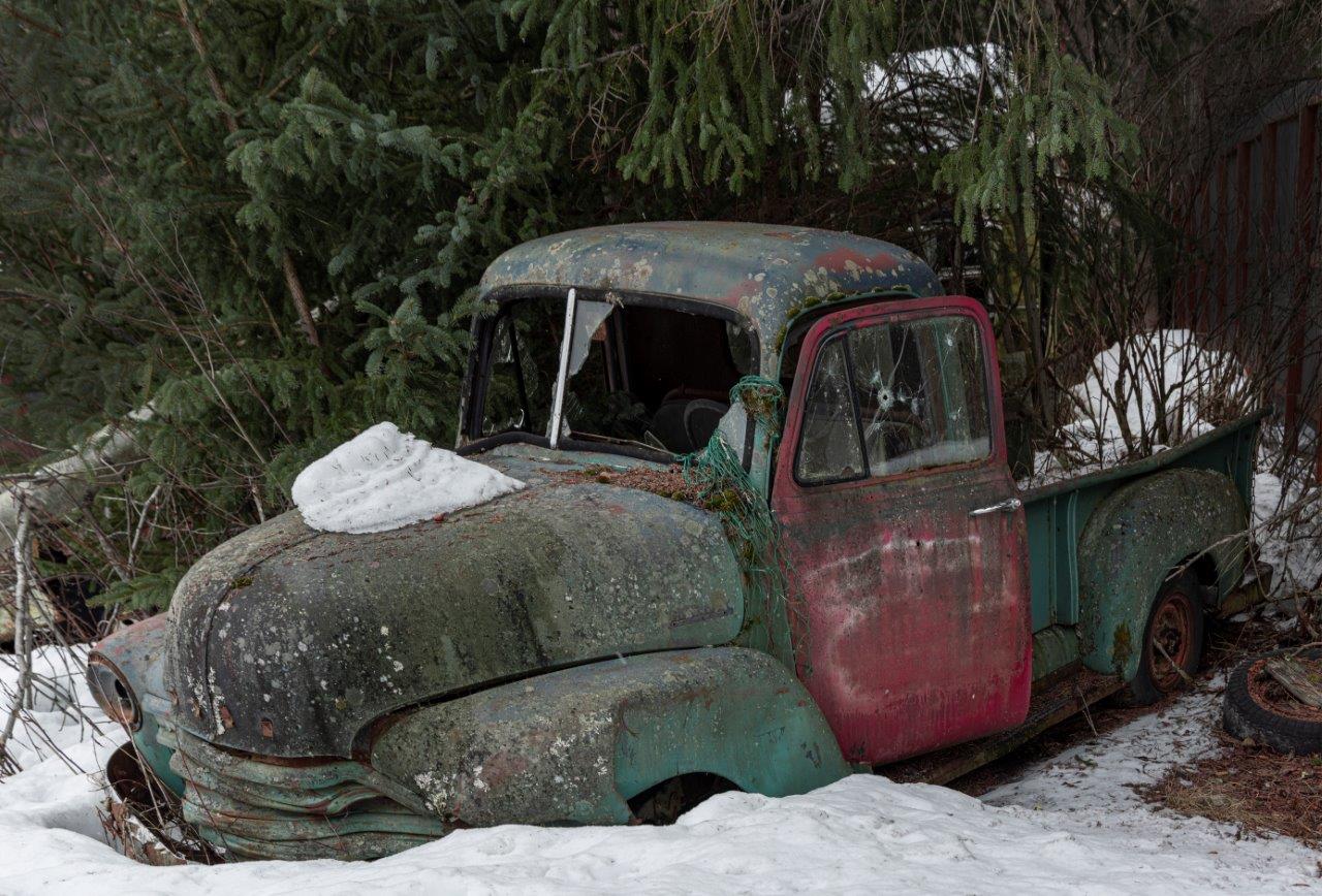 run down truck stuck in the snow of Alaska
